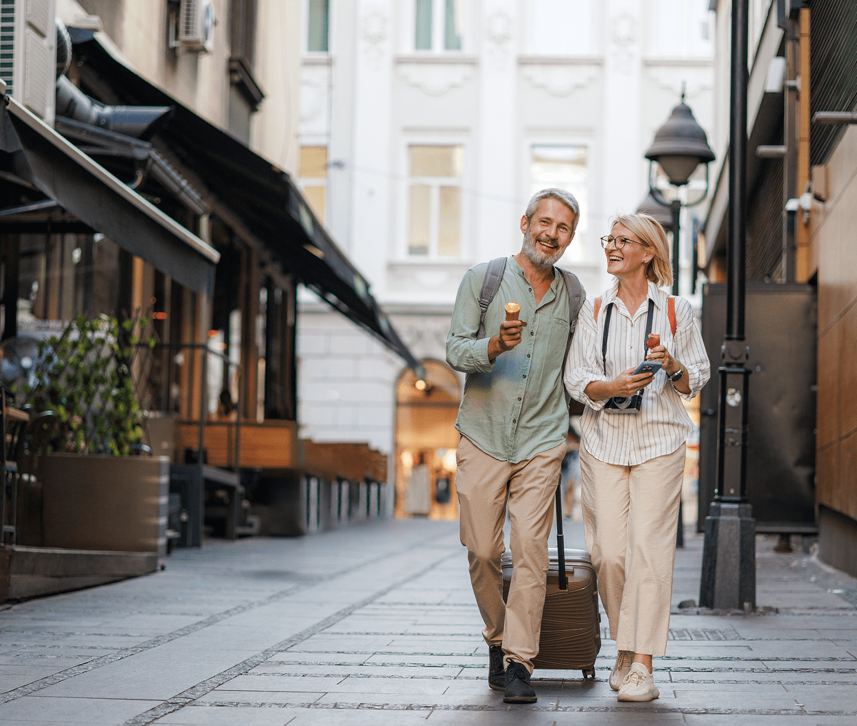 Couple enjoying ice cream while traveling