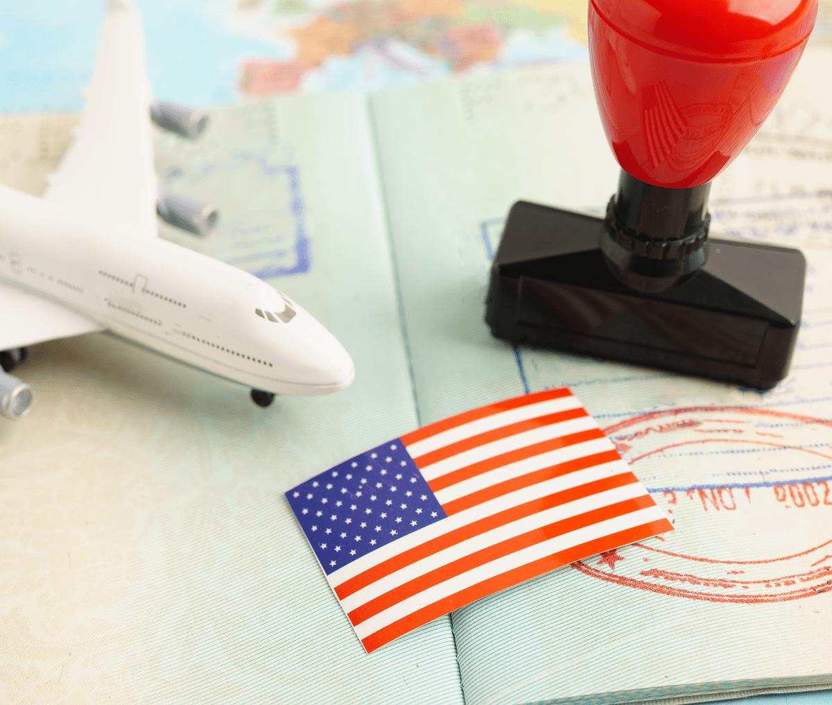 Passport, model airplane, and American flag
