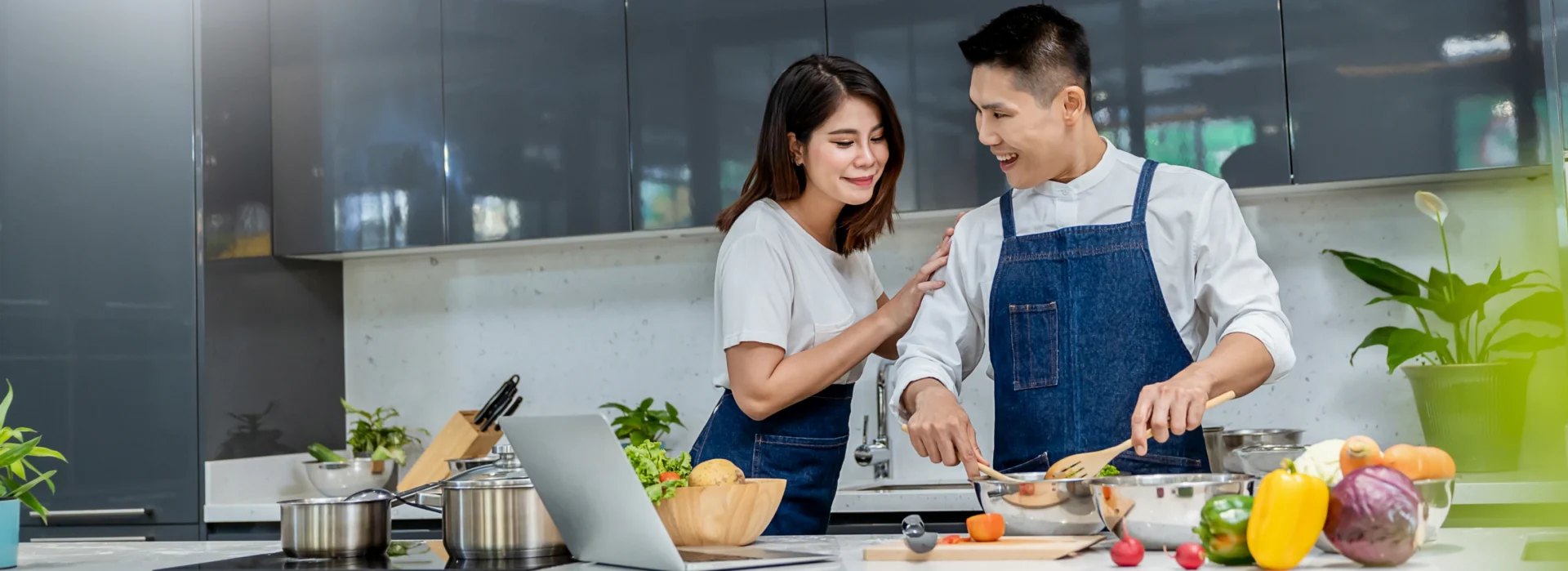 Couple cooking together in modern kitchen