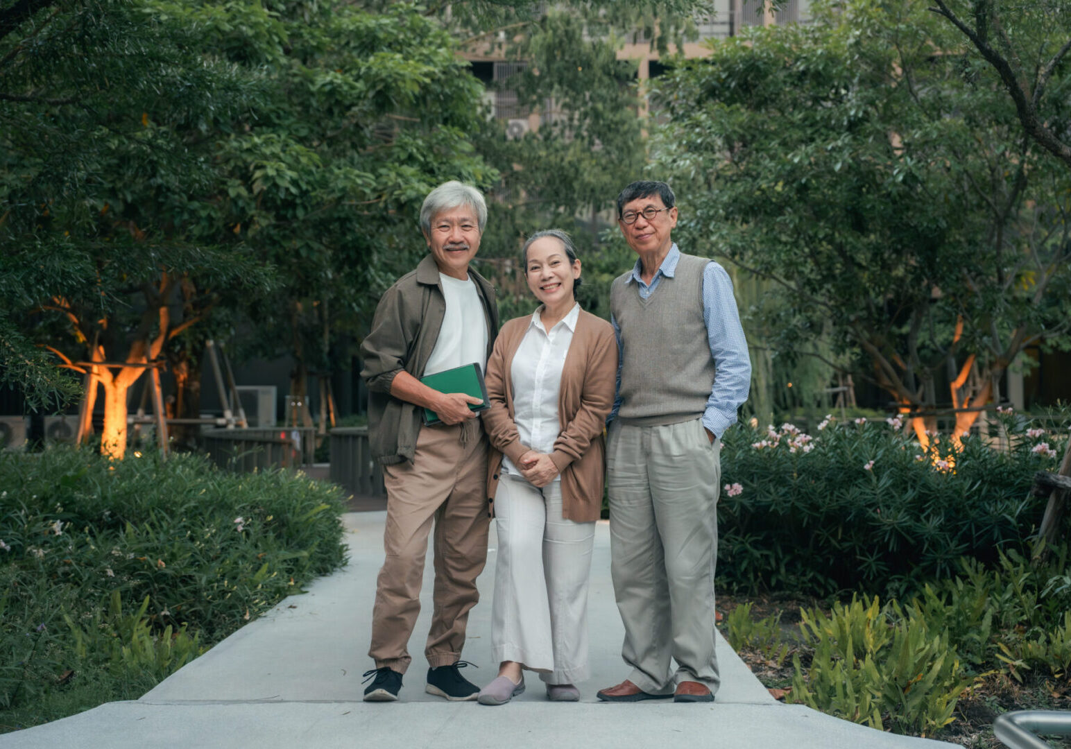 Elderly friends posing in a garden